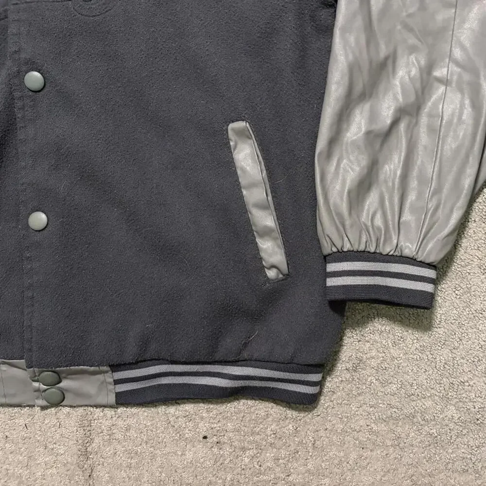 Black varsity jacket with white